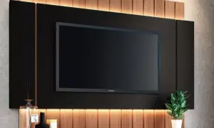 Modern TV wall with integrated lighting and wood accents. Great ideas para tapar cables en la pared, ocultándolos tras el panel negro.