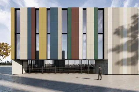 Edificio moderno con fachada de paneles verticales de colores, como si hubieran decidido enlucir pared exterior con un diseño vibrante.