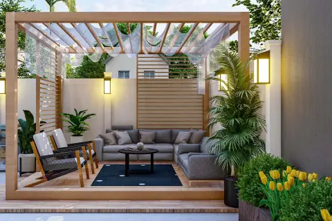 Un espacio acogedor con sofá, sillones y plantas, ideal para el diseño de jardines pequeños. Flores amarillas y luces cálidas crean un ambiente relajante.