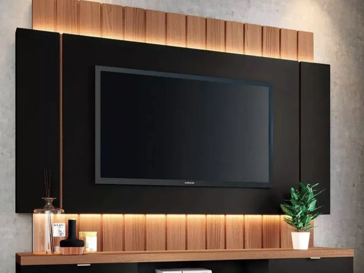 Modern TV wall with integrated lighting and wood accents. Great ideas para tapar cables en la pared, ocultándolos tras el panel negro.