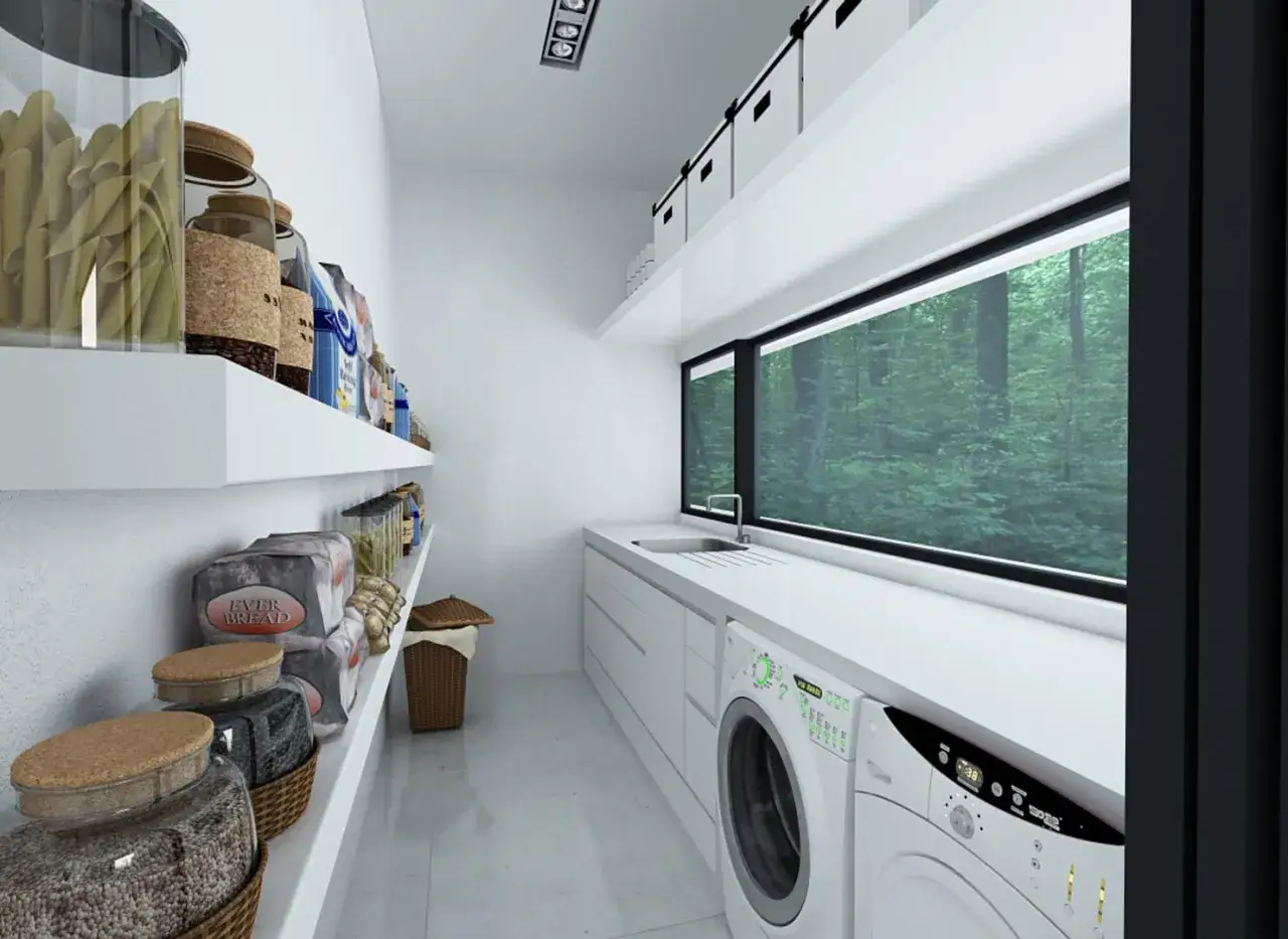 Lavaderos con encanto: despensa organizada y lavadora moderna con vista a un bosque frondoso.